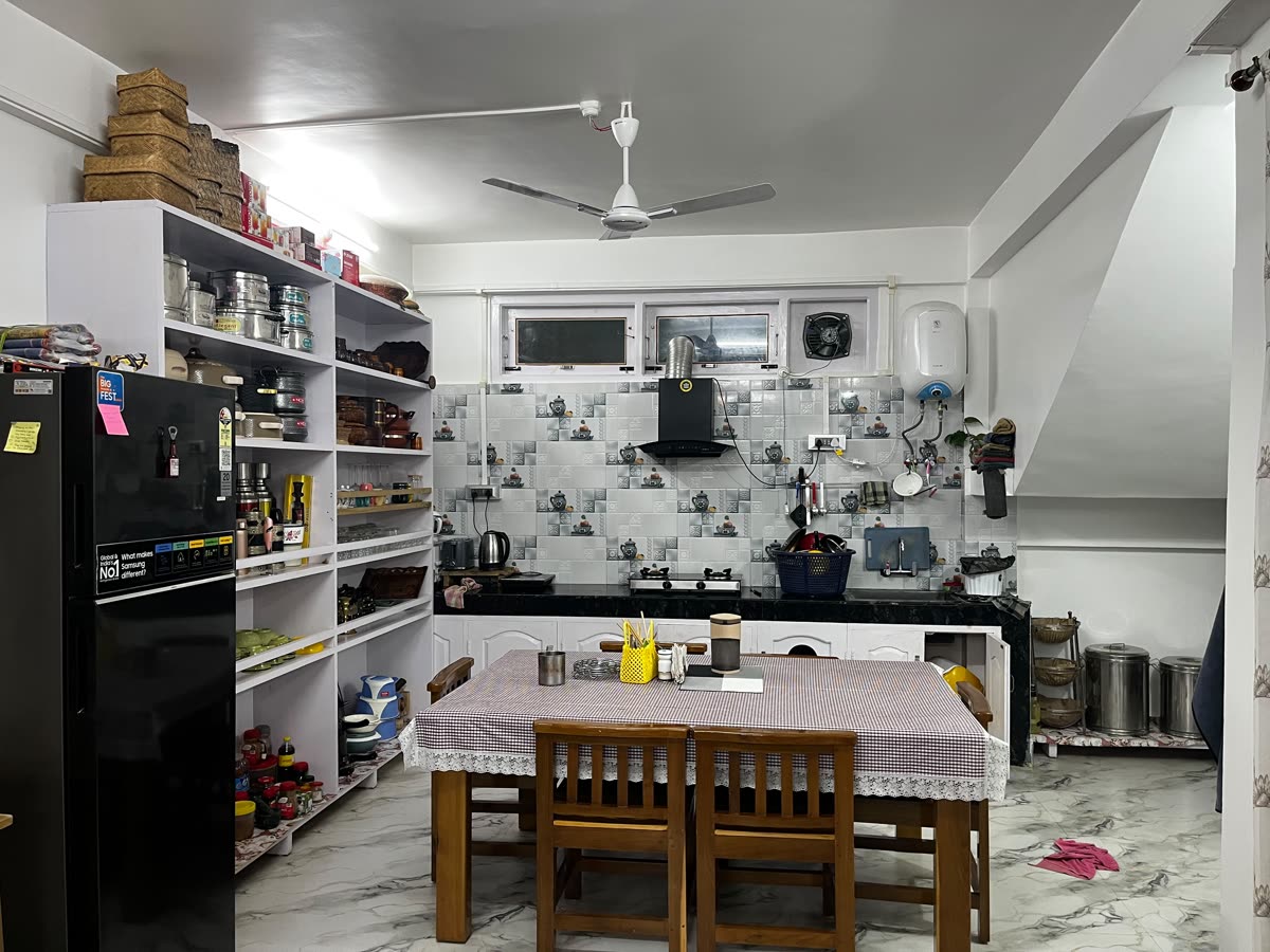 Kitchen and dining area where home-cooked meals are prepared at Gonpapa Homestay